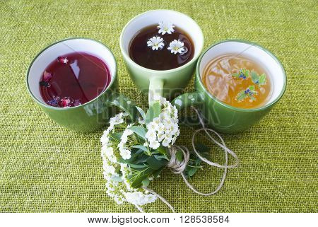 black, green and fruit tea with a bouquet of flowers.