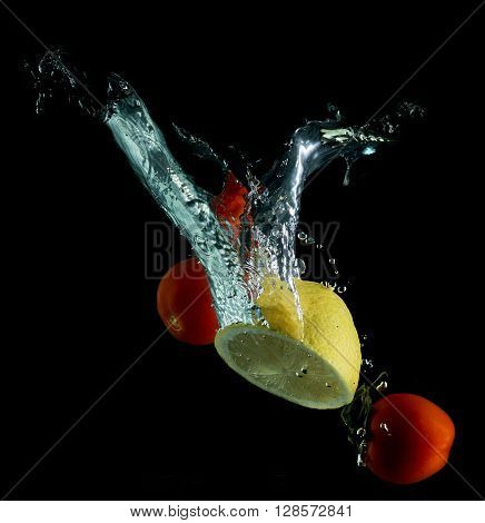 matoes and lemon on black background falling into the water
** Note: Visible grain at 100%, best at smaller sizes