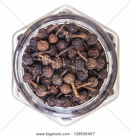 cubeb pepper in glass bottle, isolated on white background