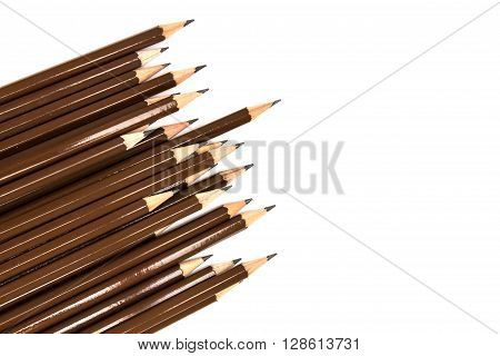 brown wooden pencil arrange on the white background
