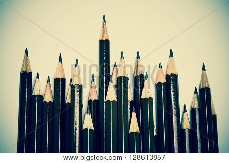 brown wooden pencil arrange on the white background