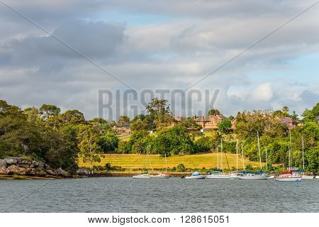 Sydney Australia - November 10 2014: Mansions on the banks of the Parramatta River in cloudy weather Sydney suburb New South Wales Australia.