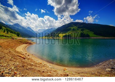 Amazing summer morning on the fantastic Speicher Durlassboden lake. Alps, Austria, Europe.