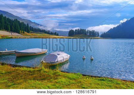 Amazing sunny day at Champferersee lake in the Swiss Alps. Silvaplana village, Switzerland, Europe.