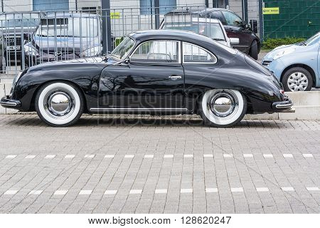 VELBERT NRW GERMANY - APRIL 06 2016: Black vintage  car 1600 with whitewall tires on a car park in Velbert city center Germany.