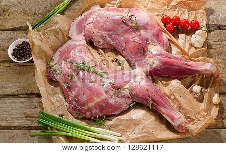Raw Lamb Shanks Ready For Frying On  Rustic Wooden Board.