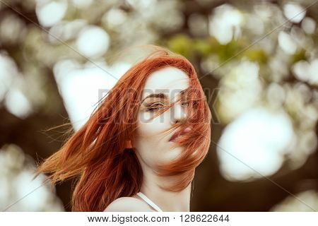 Dreammy Portrait Of Young Redhead Woman On Blured Background