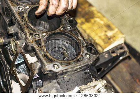 Hands Repairing A Car Engine With A Wrench