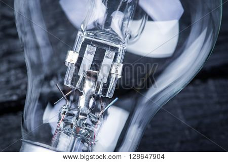 Tungsten bulb on a black wooden table