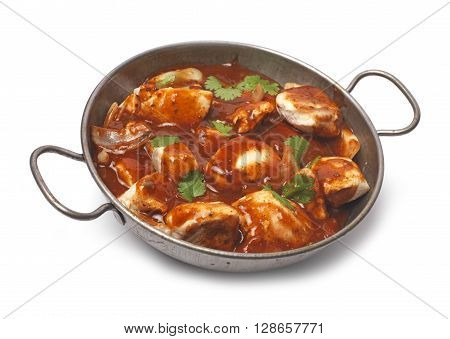 Curry in a balti dish on a table top