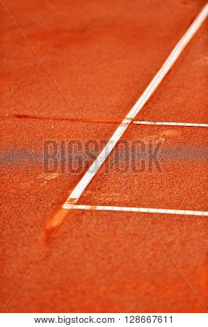 Detail with a baseline footprint on a tennis clay court