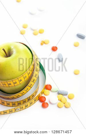 Fresh Green Apple With Measuring Tape And Pills