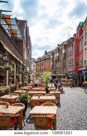 Aachen, Germany - April 13 : Tourists on foot Street in Aachen, Germany. Aachen was a residence of Charlemagne, and later the coronation place for German kings. April 13, 2016 in Aachen, Germany