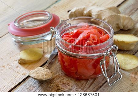 Ginger Root And Slices Of Pickled Ginger On A Wooden Table