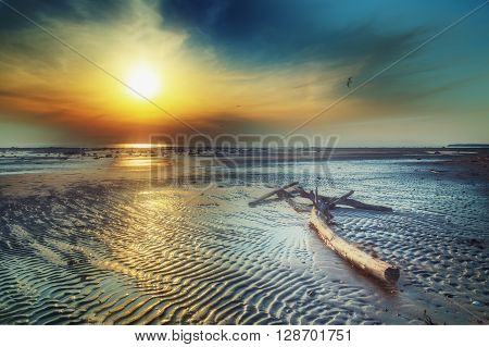 Sunset on the coast of the warm sea.