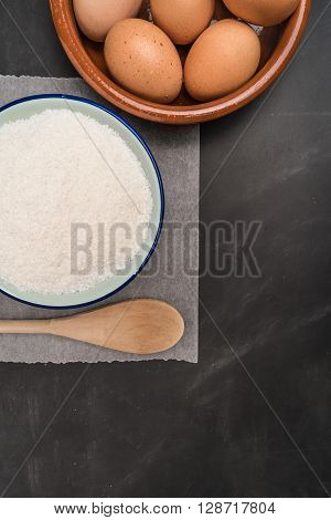 Ingredients for baking a cookies. Recipe for coconut macaroons. Top view with copy space.