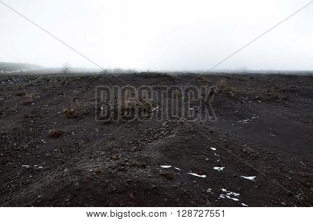 landscape scenery with volcanic rock and cloudy mist