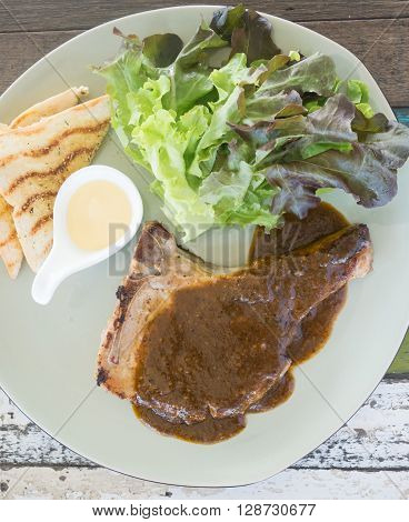 view top of pork steak with black pepper