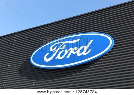 Skanderborg, Denmark - May 5, 2016: Ford logo on a wall. Ford is an American multinational automaker headquartered in Dearborn, Michigan, USA