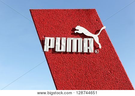 Skanderborg, Denmark - May 5, 2016: Puma logo on a wall. Puma is a major german multinational company that produces athletic and casual footwear, as well as sportswear, headquartered in Herzogenaurach in Germany