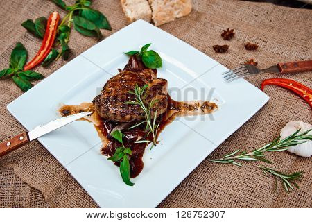 Beautiful Juicy Pork Steak Cooked On The Grill With Caramelized Onions