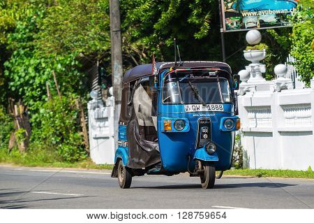 Bentota, Sri Lanka - December 31, 2015: Tuk-tuk Moto Taxi On The Street. Famous Thai Moto-taxi Calle