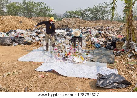 PAI, THAILAND - April 10, 2016 : Councils officer prepare Screeners in the garbage disposal pond in Pai,Thailand