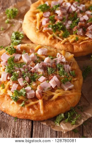 Hungarian Food: Langos With Ham And Cheese Close-up. Vertical