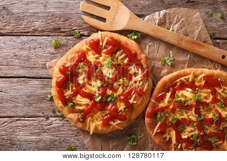 Hungarian Food: Langos With Cheese And Ketchup Close-up. Horizontal Top View