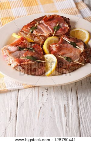 Beef Saltimbocca With Sage And Ham Close-up. Vertical