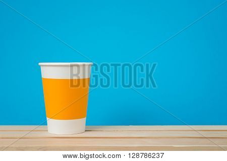 Paper cup with Sleeve on blue background