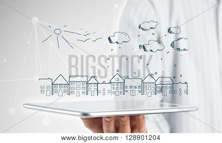 Hand of businessman demostrating tablet and construction concept on screen
