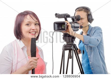 a young woman journalist with a microphone and camerawoman