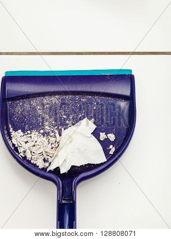 Scoop hygene chores housework tidying sweeping concept. Dust pan with garbage. Sweeping tool with dirt.