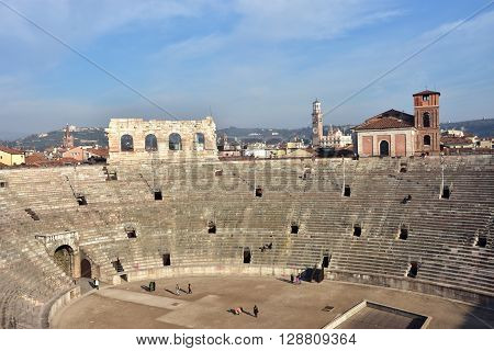 VERONA, ITALY - DECEMBER 15: Panoramic view of the famous Verona Arena an ancient roman amphitheater still in use with city skyline DECEMBER 15, 2015 in Verona, Italy