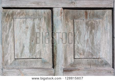 Background texture of dirty grungy plywood board with scratches and cracks.