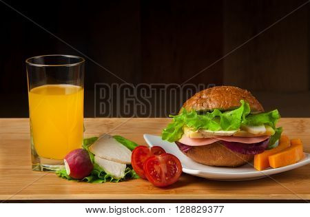 Sandwich with chicken, cheese and salad. Healthy fast food.