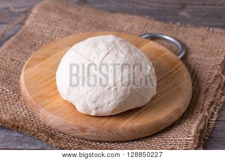 Ball of dough on a cutting board