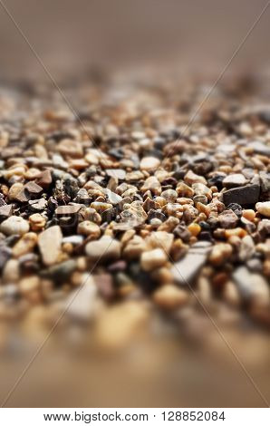 A photo background with different brown stones.
** Note: Shallow depth of field