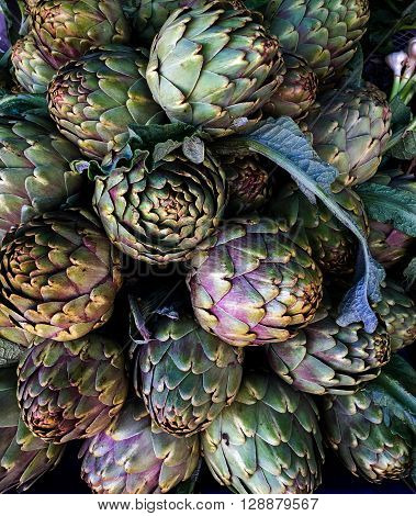 Artichokes on farmers market in the south of Mediterranean, top view