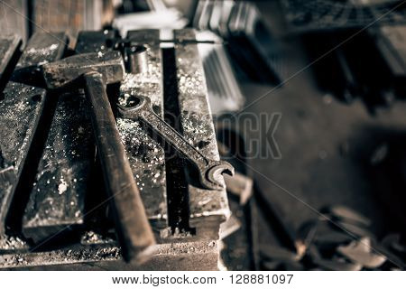 Industrial Tools In Old Factory, Metal Table With Mechanic Wrench And Hammer