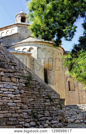 Saint Guilhem le desert church in a cloudy day Details in Saint Guilhem le desert a town in south of France