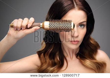 Round brush for styling hair. Beautiful healthy hair.