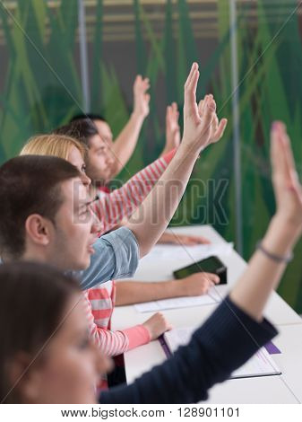 senior teacher teaching lessons, smart students group raise hands up in school  classroom on class