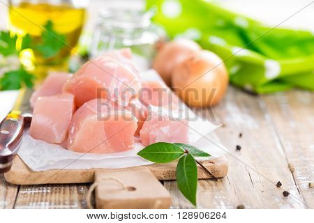 raw chicken fillet meat on a board