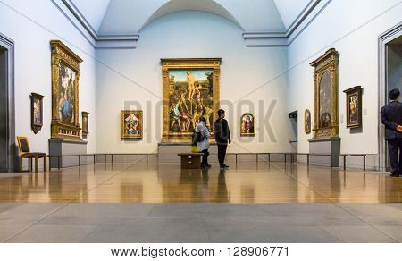 LONDON UK - JUNE 7 2015: Unidentified visitors in one of the halls of the National Gallery