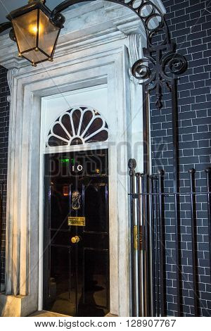 LONDON UK - JUNE 7 2015: Entrance door of 10 Downing Street. The street was built in the 1680s by Sir George Downing and is now the residence of the Prime Minister.