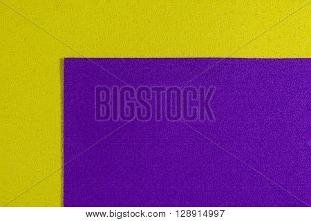 Eva foam ethylene vinyl acetate purple surface on lemon yellow sponge plush background