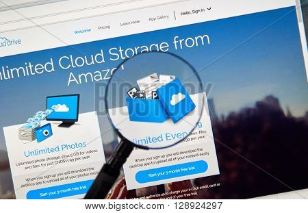 MONTREAL CANADA - MAY 8 2016 : Amazon Cloud Drive web page under magnifying glass. Amazon Cloud Drive is a web storage application from Amazon.
