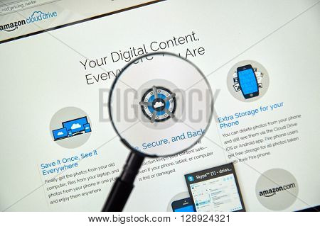 MONTREAL CANADA - MAY 8 2016 : Amazon Cloud Drive web page under magnifying glass. Amazon Cloud Drive is a web storage application from Amazon.